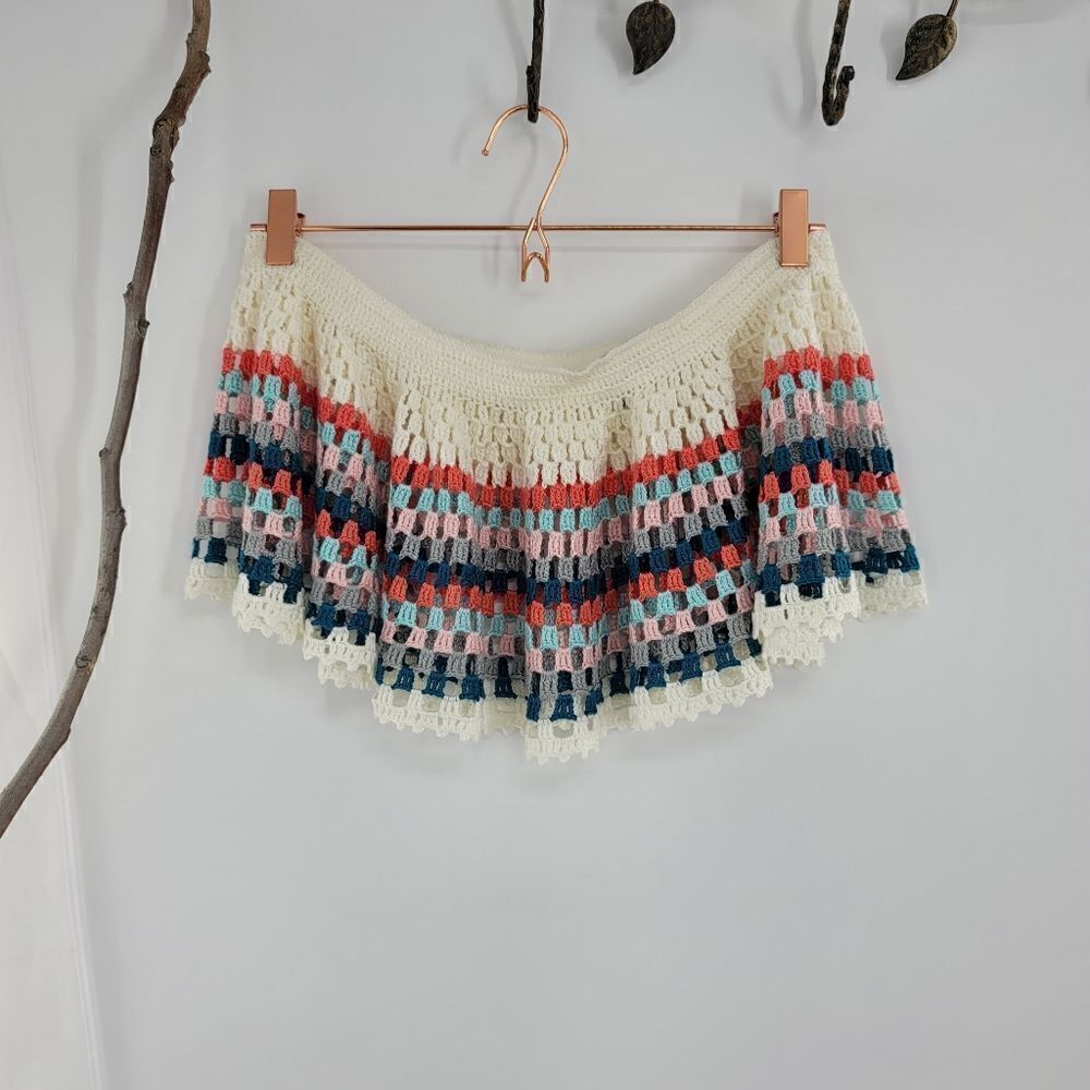 My beachy side sits in hip.hand crochet skirt